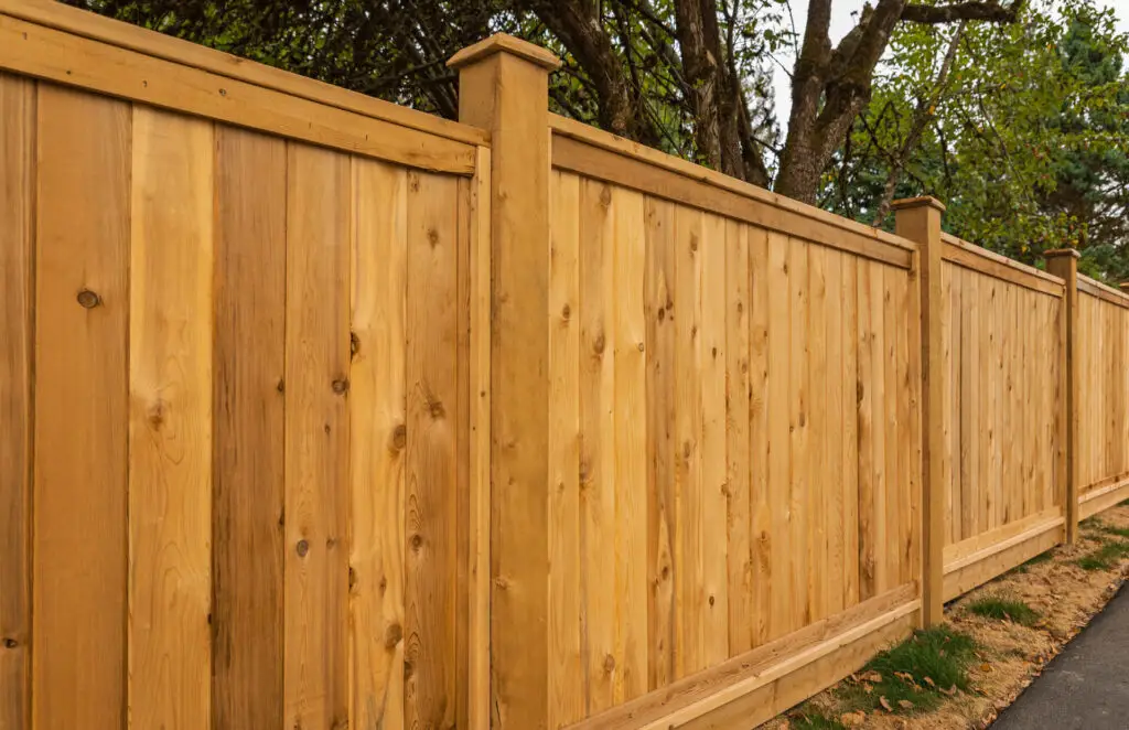 Wood privacy fence surrounding residential property