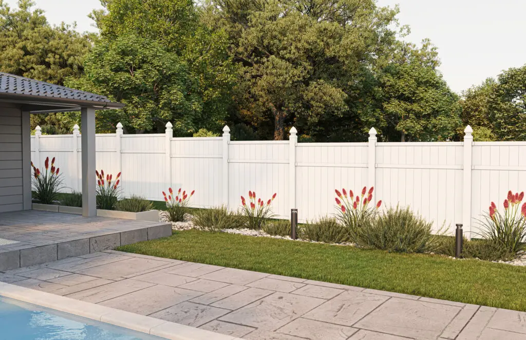 White vinyl privacy fence surrounding backyard
