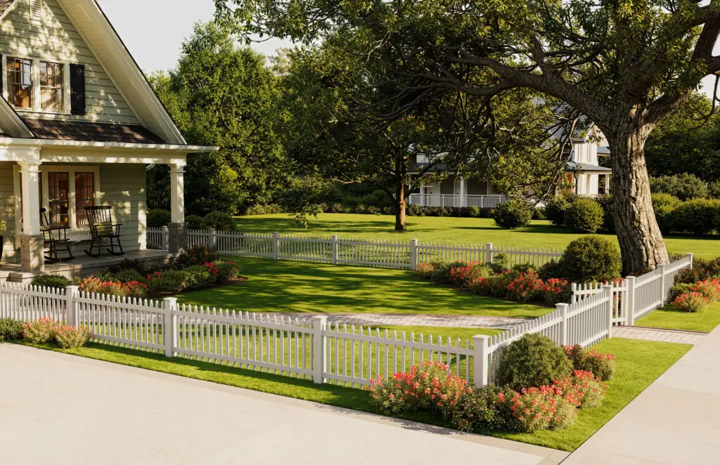 White vinyl picket fence surrounding front yard