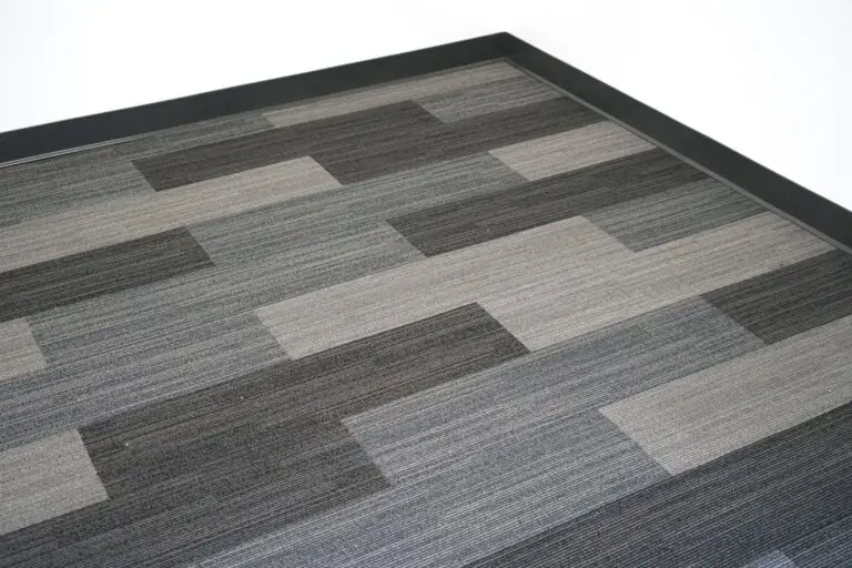 Modern gray and black commercial carpet tiles installed in an office